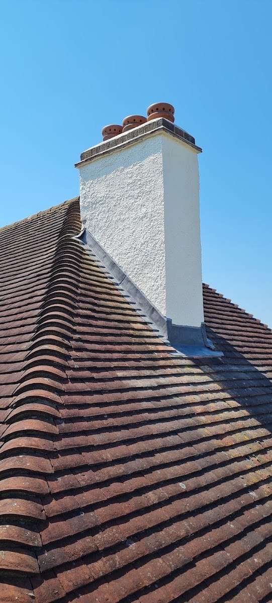 Clay tile roof and chimney flashing, by Pro Roofing